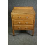 An early 20th century light oak Cotswold School style chest. H.86 W.68 D.44cm.