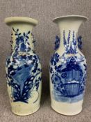 Two 19th century Chinese blue and white porcelain baluster shaped vases with floral design. H.59cm