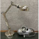 A contemporary chrome anglepoise style desk lamp, along with a Chiron surgical lamp by Mayer and