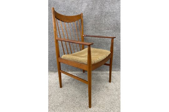 A set of four mid century Danish teak dining chairs with splayed spindle back design and a drop in - Image 8 of 13