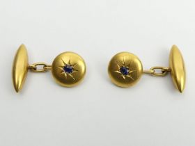 A pair of 18ct gold sapphire set cufflinks, 5.4 grams, 12mm diameter.