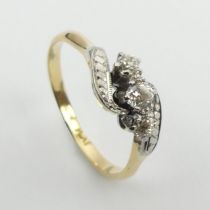 18ct gold and platinum three stone diamond ring, 3.4 grams, 7.9mm, size R.