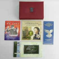 A UK 2002 proof coin collection, a 2006 UK Euro coin collection, VE Anniversary coins, five pound