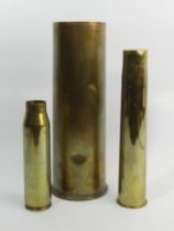 World War I shell case and two others, largest 29.5cm.