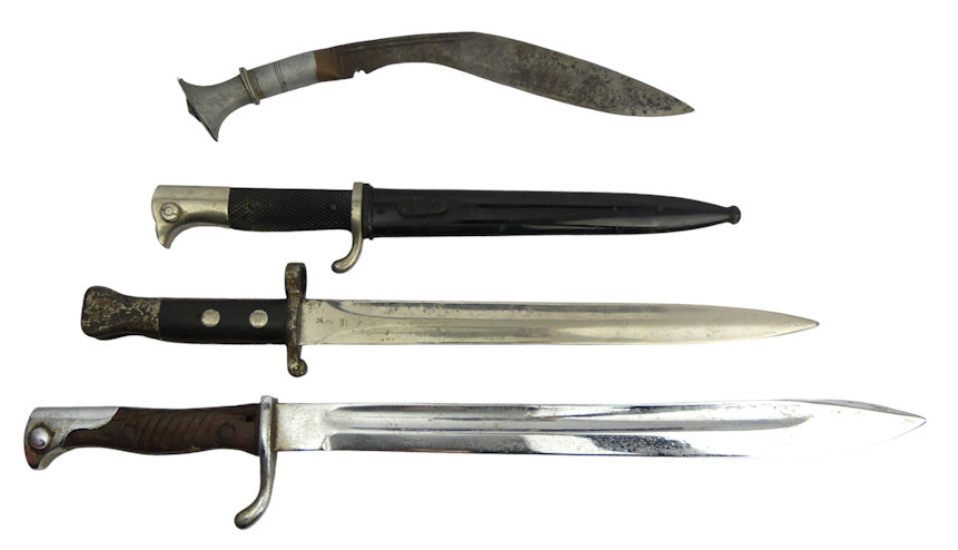 Three bayonets including a short German bayonet along with a World War II Kukri, longest 50cm.