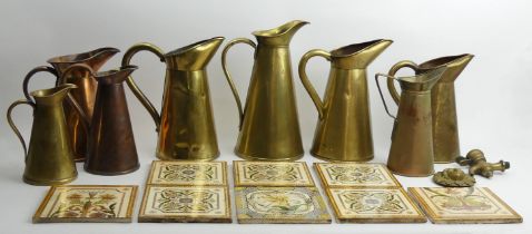 Eight Victorian tiles and a quantity of copper and brass jugs.