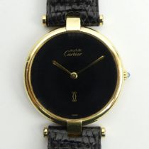 Must De Cartier silver vermeil quartz watch on a black leather Cartier strap, 32mm.