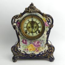 Victorian china mantel clock with a visible escapement, 33cm x 24cm x 12cm.