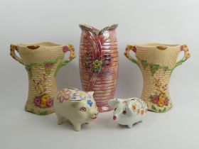 A pair of Art Deco Arthur Wood pottery vases, a lustre vase and two pig money boxes, tallest vase