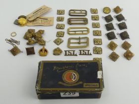 A box of military buttons, badges and buttons.