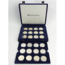 A presentation case of royal commemorative and other coins. UK Postage £14.
