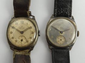 Two Smiths silver wristwatches on leather straps, 31mm wide inc. buttons.