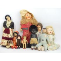 A group of eleven mostly mid-20th century dolls along with a cloth Knickerbocker figure of Spock.