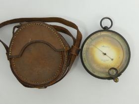 Stanley compensated aneroid barometer probably military issue in a brown leather case, 7.5cm