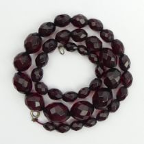 Cherry amber/Bakelite faceted bead necklace, 28.6 grams, 14mm x 19mm largest bead, 48cm long.