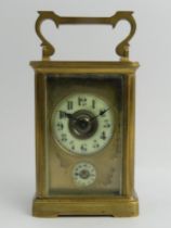 Late Victorian brass carriage clock with alarm function, 14.5cm to top of handle.