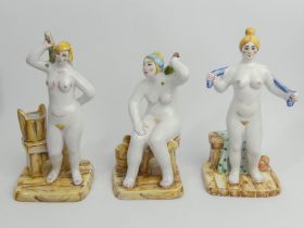 Three Russian pottery figures of a lady bathing, tallest 19cm.