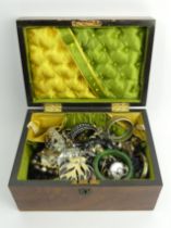 A Victorian walnut jewellery box and contents including a silver hinged bangle.