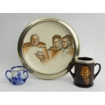 Royal Doulton Kingsware loving cup, Norfolk pattern tyg and a jovial monk coaster, coaster 16cm.