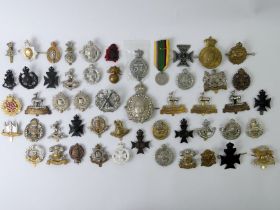 47 various military cap badges, including The Connaught Rangers, The welsh and The Lancaster