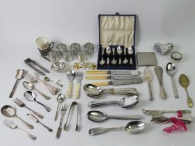A box of silver and plated items, including a silver cigarette case.