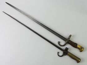 A French model bayonet 1874 (blade length 51.5 cm) together with an 1886 LaBel epee bayonet (Blade
