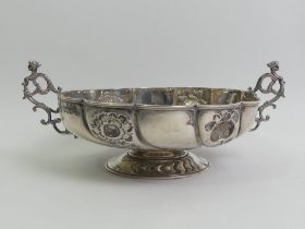 A Victorian ornate twin handled silver pedestal bowl, London 1898. 224 grams. 19.5 x 8 cm.