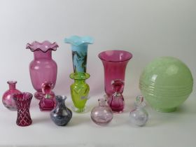 Twelve items of Cranberry and other glass ware includingscent bottles and vases. Blue vase 25 cm.