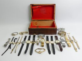 A box of watches including Seiko and Oris.