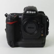 A Nikon D3 SLRS digital camera boxed with paperwork.
