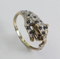 9ct gold sapphire and diamond leopard design ring, 2.4 grams. Size N 9.6 mm wide.