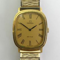 Omega De Ville gold tone manual wind watch with box and papers. 28mm wide including button.