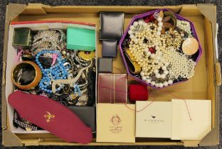A box of mixed costume jewellery including faux pearl necklaces.