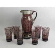 Venitian amethyst glass water jug and six glasses with silver overlay decoration, jug 29.5cm.