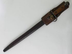 A British SMLE bayonet 1907 pattern in the original scabbard. Blade 43 cm.
