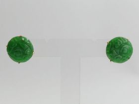 A pair of 18ct gold carved jade set earrings, 4.9 grams, 16mm in diameter.