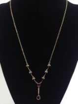 9ct gold garnet and seed pearl pendant necklace, 5.9 grams, 44cm long.