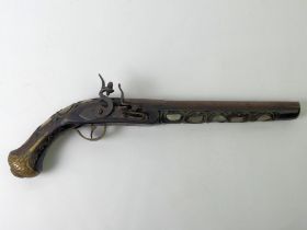 A reproduction Indian flintlock pistol with brass and mother of pearl decoration. 43 cm.