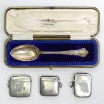 Three old silver vesta cases, various dates and makers along with a cased silver presentation spoon.