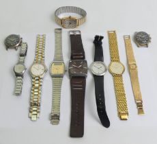 A box of various mostly gents watches including a Timex example.