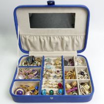 A jewellery box and contents including silver rings.