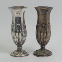 A pair of Victorian silver vases, Birm.1892, 193 grams albeit weighted. 10.5 cm high.