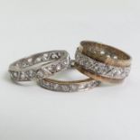 Three 9ct gold stone set eternity rings,10.7 grams.