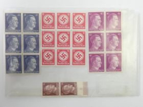 Twenty three World War II German stamps.