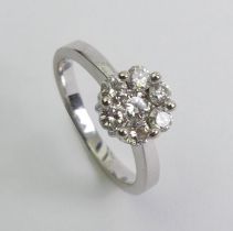 14ct white gold diamond cluster ring, 3.4 grams. Size M 1/2 8.5 mm wide.