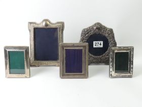 Five silver photo frames, various dates and makers. Largest 19cm.