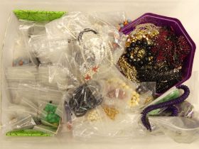 A box of beads and bead necklaces along with paste set necklaces and coral necklaces.