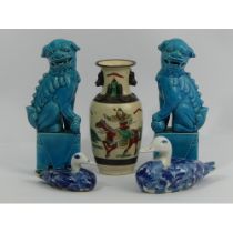 A pair of Chinese turquoise glazed temple lions, a Chinese crackle ware warrior vase and two