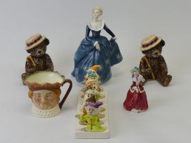 Royal Doulton Character jug, Royal Doulton figurines and a Disney toast rack. Tallest figure 20cm.