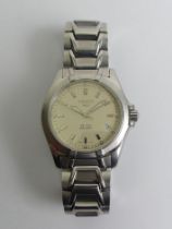 Gents Tissot P660/760 date adjust quartz watch with a cream linen type dial. 41.6 mm including the